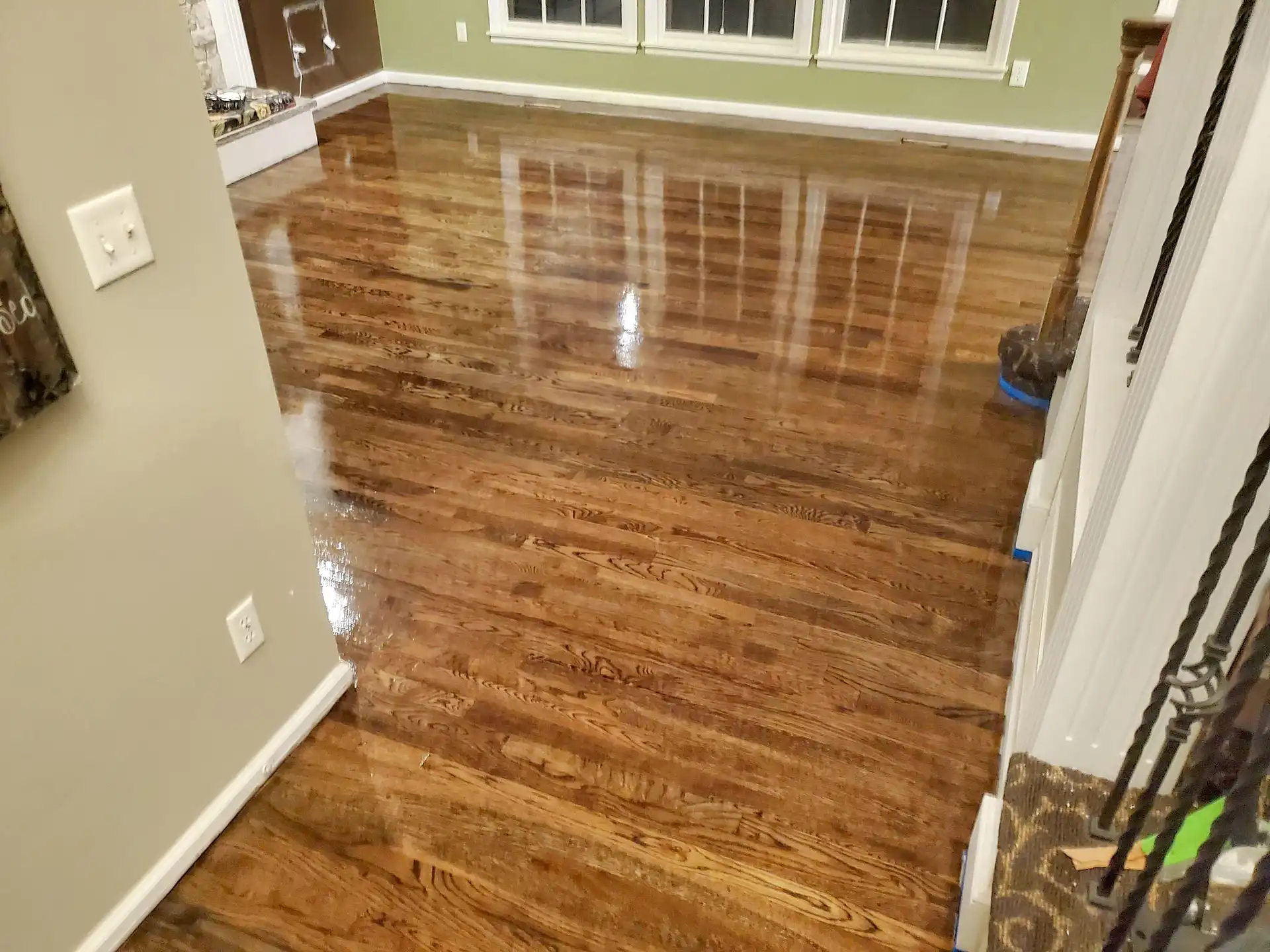 Hardwood floor refinishing with poly coat in Overland Park