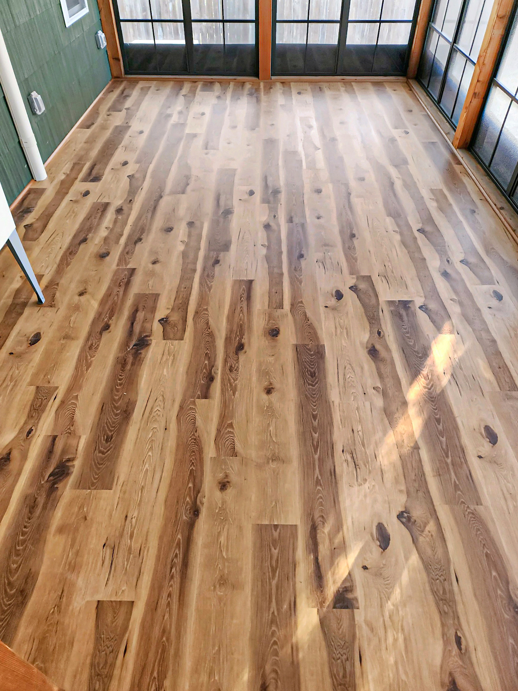 Leawood luxury vinyl plank flooring installation in Kansas City sun room