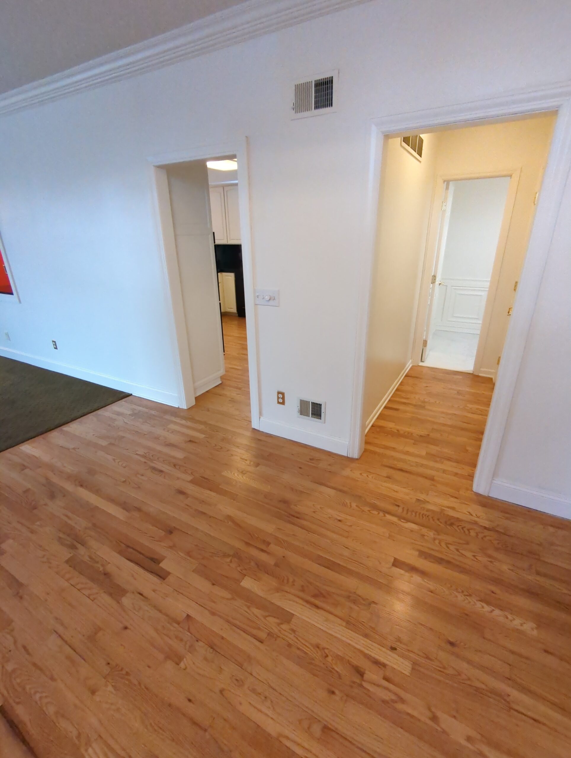 Entryway hardwood floor before refinishing